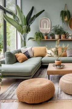 a living room filled with lots of furniture and plants