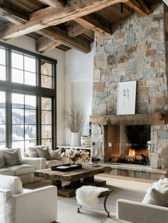 Warm and Inviting Rustic Home: Stone Fireplace and Cozy Atmosphere Cabin Stone Fireplace, Large Open Fireplace, Fireplaces With Stone, Rustic Stone Fireplace Ideas, Rustic Living Room With Fireplace, Mountain Fireplace, Tall Rustic Fireplace, Fireplace With Seating, Fireplace Mountain Home