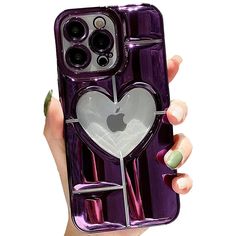 a woman holding up an iphone case with a heart on the front and back side