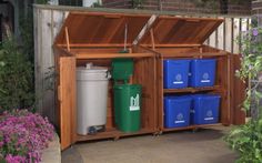 an outdoor storage area with blue and green containers