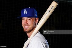 the los angeles dodgers baseball player poses with his bat