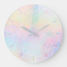 a clock with pastel colors and geometric design on the face is shown in this image