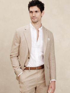 LINEN-BLEND: This light and breathable fabric is a must for those warm days and styles effortlessly for all occasions. Customer favorite linen-blend jacket returns with matching trousers this season to complete the full suit look. Notch collar with button hole on wearers left panel. Four non-functioning buttons at cuffs. Two-button front closure. Front pockets. Chest pocket. Internal pockets. Single back vent. Matching suit trouser available. Made exclusively for Banana Republic Factory. #873658 Fashionable Mens Suits, Formal Groomsmen Attire, Tan Suit Wedding, Day Wedding Outfit, Outdoor Wedding Guest Dresses, Suits For Guys