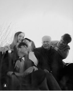 a group of people sitting next to each other