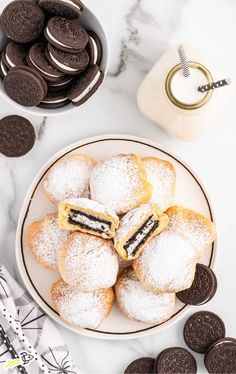 cookies and oreo cookies on a white plate