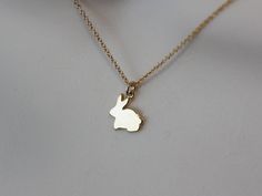 Gold Plated chain necklace with a Gold Plated Rabbit Bunny flat charm 10 x 12 mm. For better use of this necklace please keep it dry out of any liquid. Great gift idea! Also available in Silver -- https://www.etsy.com/listing/259369784/bunny-rabbit-cute-charm-silver-necklace Your order will be wrapped and shipped in a jewelry gift box. Please enter my shop here - www.etsy.com/shop/ZarinaJewelry or my FB page facebook.com/ZarinaJewelry Bunny Jewelry, Bunny Stuff, Rabbit Jewelry, Bunny Necklace, Bunny Baby Shower, Hanging Jewelry Organizer, Bday Gift, Charm Necklace Silver, Dainty Gold Necklace