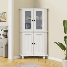 a white cabinet with glass doors in a living room