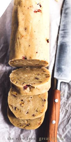 a stack of cookies sitting next to a knife