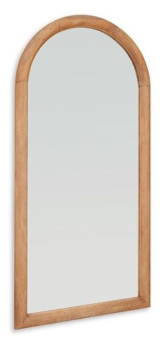 an arched wooden mirror on a white wall with a light brown frame and wood trim