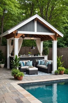 an outdoor living area next to a swimming pool