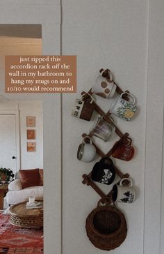 there is a coffee cup rack on the wall