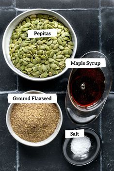 ingredients for making maple syrup in bowls on a tile counter top with labels describing the ingredients