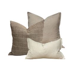 two brown and white pillows sitting next to each other