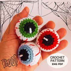 three crochet eyeballs are in the palm of someone's hand