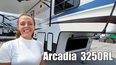 a woman standing in front of an rv with the words arcadia 3240rl on it