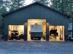 two vehicles are parked in the garage with their doors open