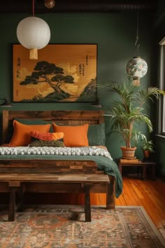 a bed sitting on top of a wooden floor next to a painting and potted plant