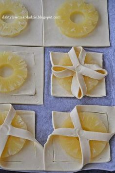 pineapple slices are cut into squares and placed on napkins with ribbon around them