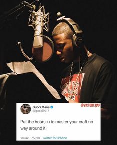 a man with headphones on in front of a microphone and an empty sign that reads, put the hour in to master your craft no way around it