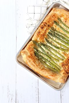 a casserole dish with asparagus and cheese