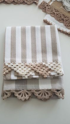 three pieces of cloth with lace on them