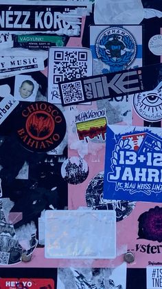 many different stickers and decals on a wall