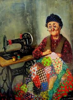 an old woman sitting in front of a sewing machine with a quilt on the table