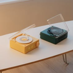 an alarm clock and record player sitting on top of a table with the words alarm clock bluetooth music player stereo effect dual - purpose design