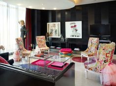 a living room filled with lots of colorful furniture