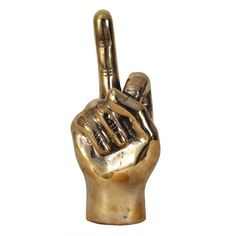 a gold colored statue of a hand making the peace sign