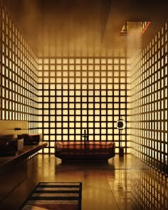 a bath room with a large tub and tiled walls