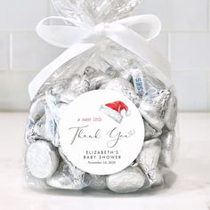 a bag filled with white chocolate candies on top of a counter