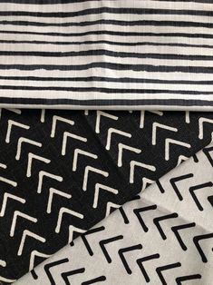 four different types of fabric with black and white designs