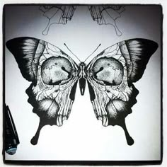 a black and white drawing of a butterfly with two wings on it's back