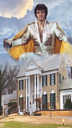 elvis presley standing in front of a large house