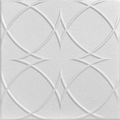 a white ceiling tile with an intricate design