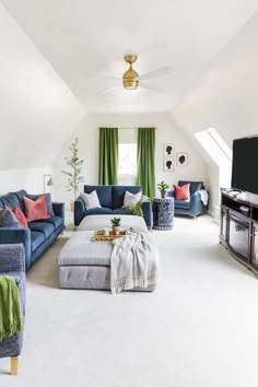 a living room filled with furniture and a flat screen tv