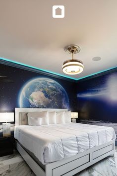 a bedroom with a large bed in the middle and a mural on the wall behind it