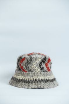 Hover is unique handmade unisex wool bucket hat with herringbone print (panama) The hat is very warm, soft and comfortable to wear. This is a wonderful birthday gift The best decision for 2021 year. SIZE: S-M (56-57 cm) Custom Made M-L (58-59 cm) Custom Made L-XL (60-61 cm) in stock Custom Made design is made after a base pattern, similar to ready-to-wear. Note that it will take our team 10 - 15 days to make your product, so remember to add this to the delivery time. MATERIAL: Made of 100% wool. Winter Hats With Herringbone Pattern And Curved Brim, Handmade Gray Winter Hat, Handmade Bucket Hat With Curved Brim For Winter, Handmade Winter Bucket Hat With Short Brim, Handmade Curved Brim Bucket Hat For Winter, Gray Wool Knitted Hat, Handmade Curved Brim Hat For Winter, Handmade Winter Hat With Curved Brim, Handmade Curved Brim Winter Hat