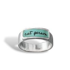 You know it, your friends know it, now you can wear it.  This ring is cast using solid sterling silver, to which 3 layers of vitreous enamel are applied and kiln fired at 1400 degrees. Vibrant, waterproof, and durable. Rings come in whole sizes 5-11. Band ranges from 1/8'' to 1/4'' wide depending on the size of the ring. Is it time to rock the cool cat ring? To see my entire shop go here: https://www.etsy.com/shop/marmar I ship First Class Mail in a gift box.  To see my gemstone and modern store Glass Store, Modern Store, Vitreous Enamel, Sterling Silver Cat, Cat Ring, Silver Cat, Jewelry For Men, Cat Person, Cat Jewelry