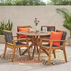 a round table with four chairs around it