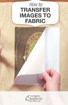 the cover of how to transfer images to fabric is being held by someone's hand