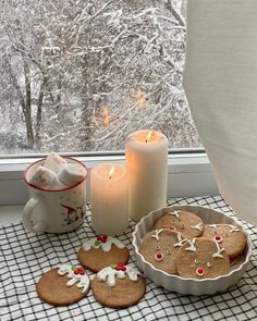 gingerbreads and cookies on a table near a window