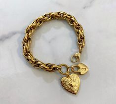 "\"Vintage amor\" line bracelet: Hearts This bracelet is made of retro style , high quality steel -thick- chunky chain that has a vintage finish . Chain is polished and has a smooth finish . This Chain has medium to large thickness and bracelet has an impressive chunky statement result . It is large but not too bulky. It is decorated with a large brass gold plated 24k brass heart , a green glass heart and a glass evil eye bead . Colorful stylish and fun . Also ideal gift idea . Closure it is mad Vintage Heart Bracelet, Gold Chunky Bracelets, Stylish Jewelry Gold, Gold Chunky Jewelry, Chunky Necklaces Statement, Chunky Charm Bracelet, Bracelet Valentines, Vintage Gold Bracelet