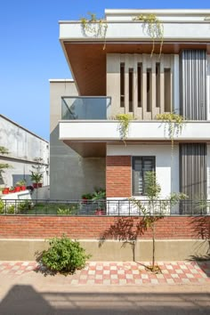 an apartment building with red brick and white walls