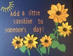 a sign with sunflowers and the words add a little sunshine to someone's day