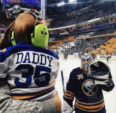 two young hockey players standing next to each other