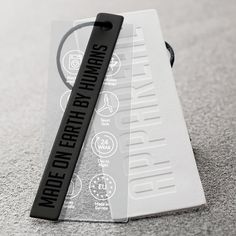 a black and white bookmark on top of a card