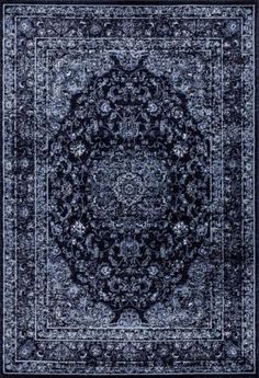 a blue rug with an intricate design on the middle and bottom part of it,