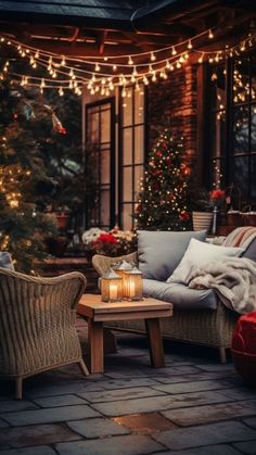 an outdoor patio decorated for christmas with lights and wicker furniture on the brick floor